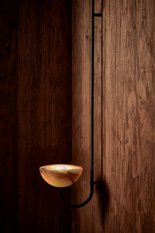 Marz Designs Aurelia Jade Onyx wall light on, brushed black finish