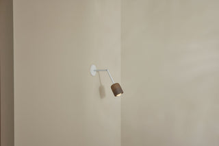 Marz Designs Terra-1 articulating wall lamp, white satin finish, on side.