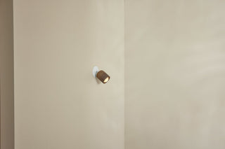 Marz Designs Terra-1 white articulating spotlight on wall