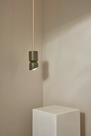 Marz Designs Terra 1.5 Olive Brass Pendant Light in corner setting
