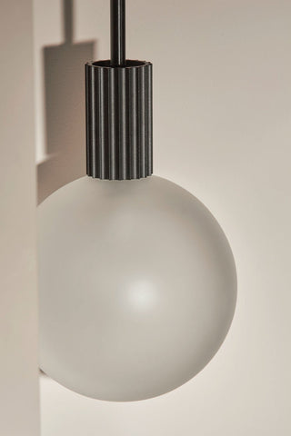 Marz Designs Attalos Pendant Light detail, frosted globe bulb.