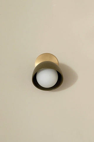 Marz Designs Terra 0 articulating wall sconce in olive and brass.