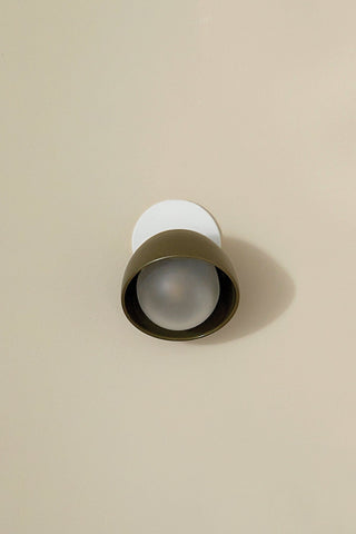 Marz Designs Terra 0 olive wall sconce with frosted glass.