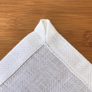 White linen napkin corner detail
