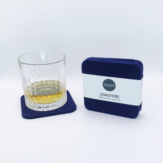 NASH square coasters with whiskey glass on white background