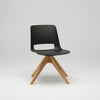 Black chair with wooden legs on a white background