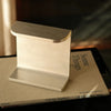 Aluminum desk lamp on book