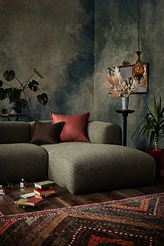 PUFFALO Lounging sofa with decorative pillows and plants