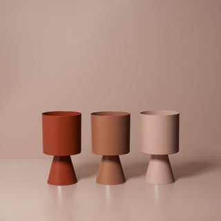 Palm Springs planters in terracotta, beige, and blush.