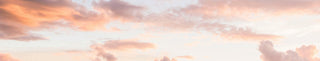 Pantone Peach Fuzz color of the year sky with clouds.