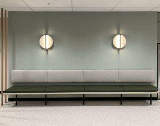 Modern waiting area bench with wall lights (May 17, 2024)
