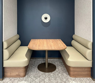 Cozy booth seating with table, edited photo from Jan 2025.