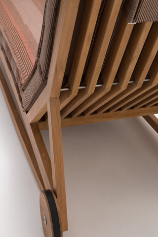 wooden lounge chair with striped cushion