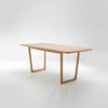 Wooden table with a minimalist design on a white background