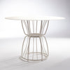 ND dining table with wireframe base on a reflective surface