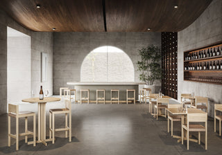 Restaurant interior with tables, chairs, and bar.
