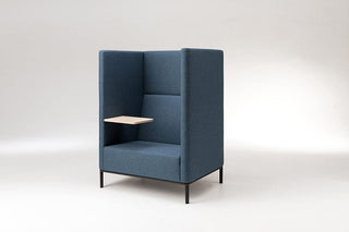 Blue booth chair with a small wooden shelf.