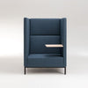 Blue high-backed chair with small side table.