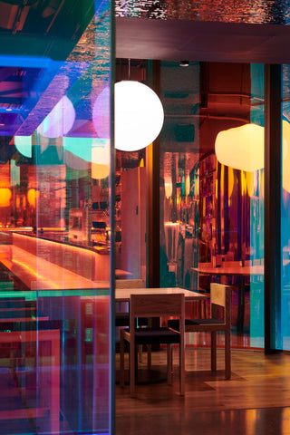 Restaurant interior with colorful glass panels.
