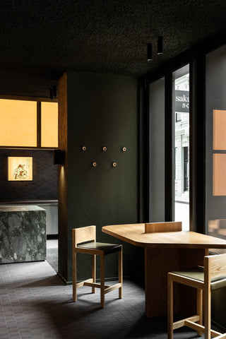 Sakura Bergman & Co. interior with wood table and chairs