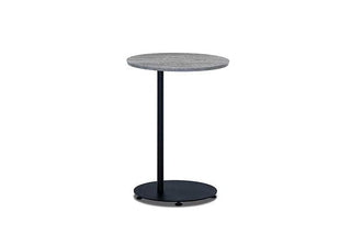 Side table with gray top and black base.