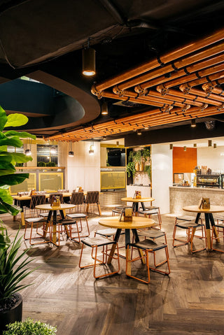Restaurant interior with tables and chairs.