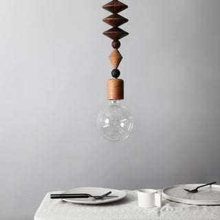 Wooden pendant lamp over dining table