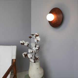 BrightBeads Disc wall sconce lamp in situ with flowers