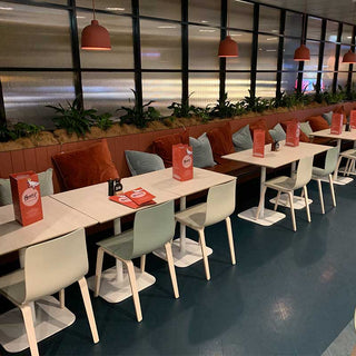 Caterpillar restaurant interior with tables and chairs.