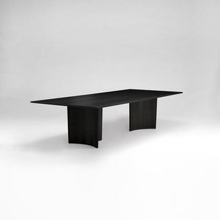 Black rectangular table with curved supports
