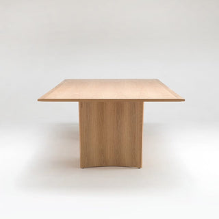 Wooden table with solid base