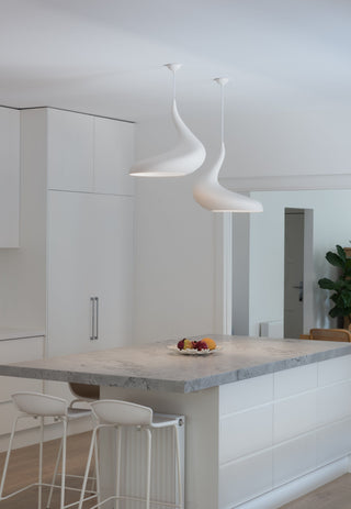 modern kitchen island with unique white pendant lights