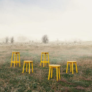 Fable outdoor scene with yellow stools