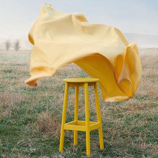 Yellow stool outdoors with flowing fabric - Fable-outdoor-06