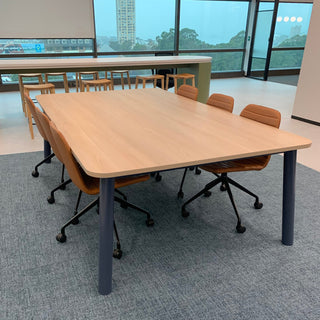 Wooden table with chairs in an office.