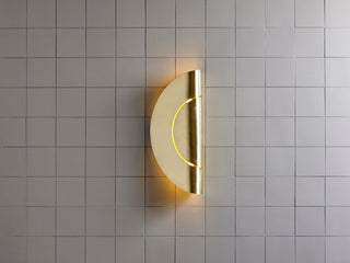 Marz Designs Furl Circle Wall Light - Raw Brass (Vertical, On)