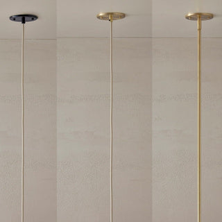 Three pendant lights with different metal finishes.
