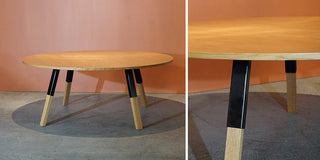 Wooden round table with black and wood legs