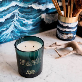 Ocean Isle candle with ocean artwork and driftwood