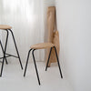 Modern wooden stools with black legs