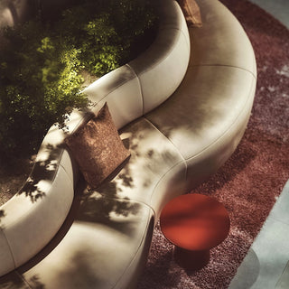 PUFFALO Universal Group Hotel lounge detail with curved sofa and table