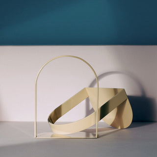 Abstract beige sculpture with arched passage design