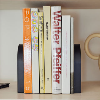 Books held by a black bookend, Passage 5