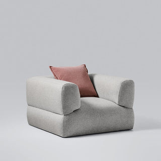 Puffalo3 modern gray armchair with pink pillow