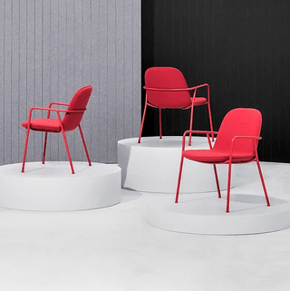 Red modern chairs on white pedestals