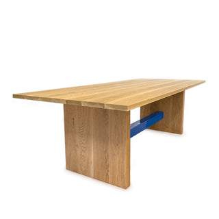 Silnisq wooden table with blue support.