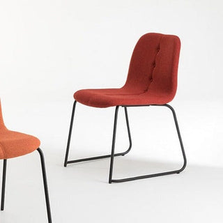 Tiller Slim Collection chair in rust with black metal legs.