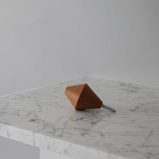 Wooden wall hook 13 on marble surface