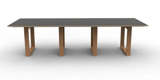 YTFEvVMb modern dining table with gray top and wood legs.