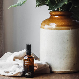 Siren Mist spray bottle with large ceramic vase